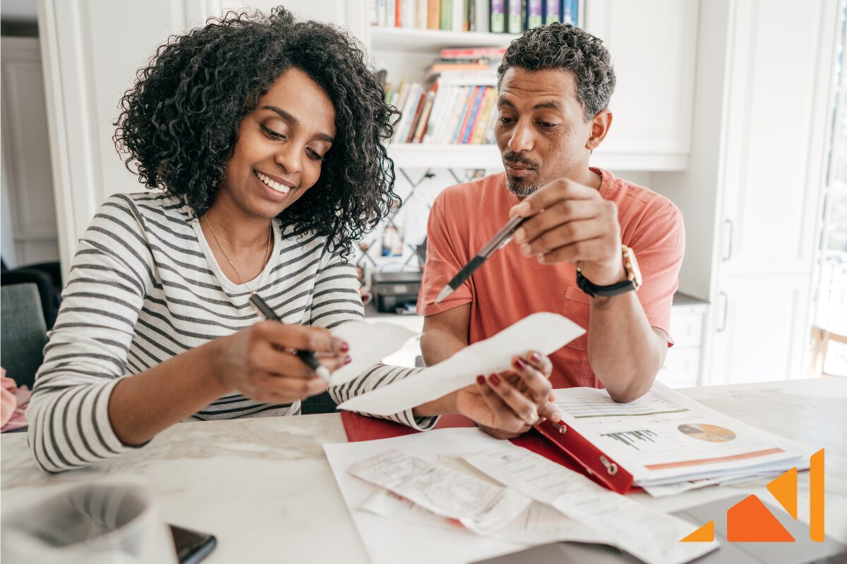 African American couple working on their less common account documents