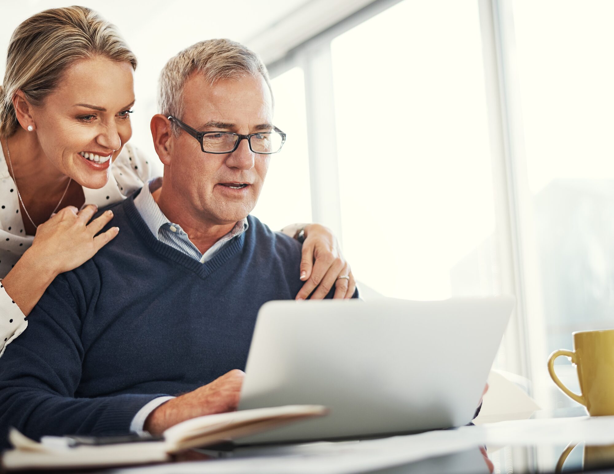 Man and woman sitting at computer